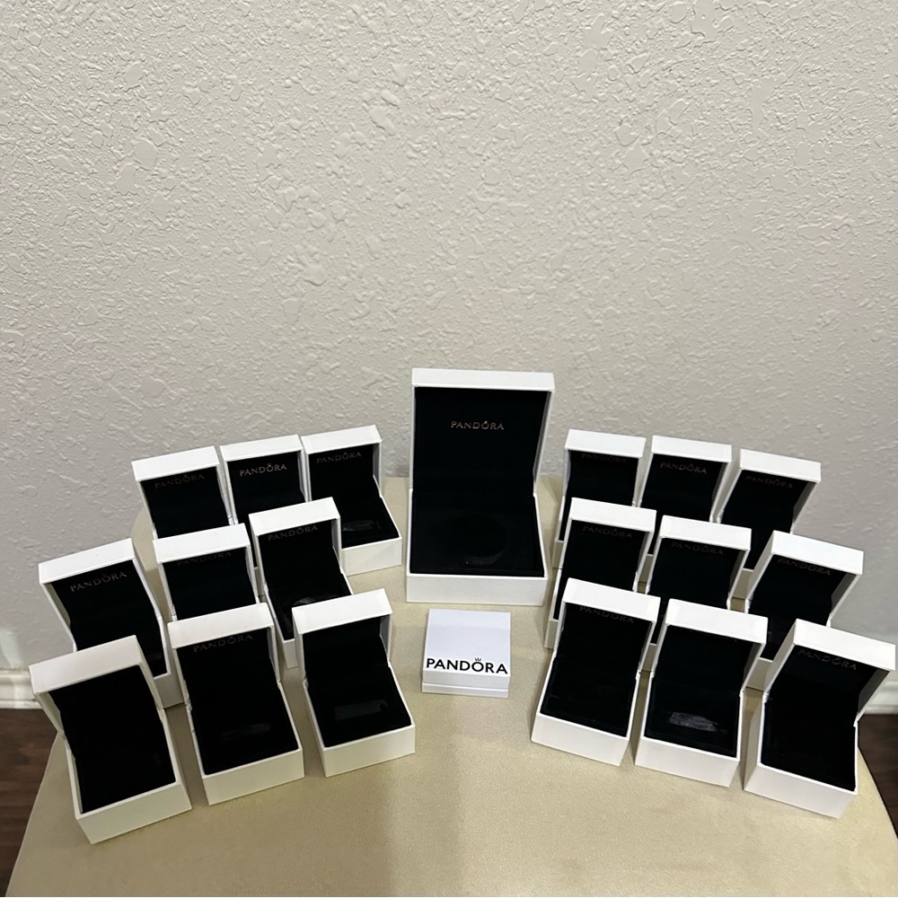 Twenty three empty pandora boxes.